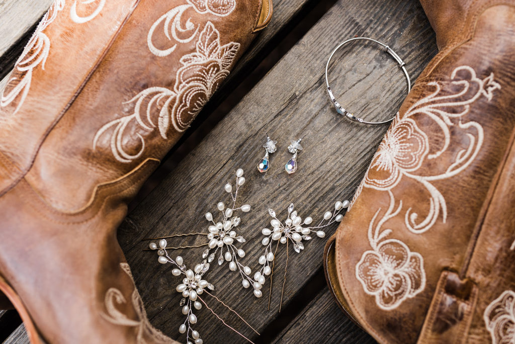 bridal wedding details boots and earrings at their Cabins on Strawberry Hill Wedding