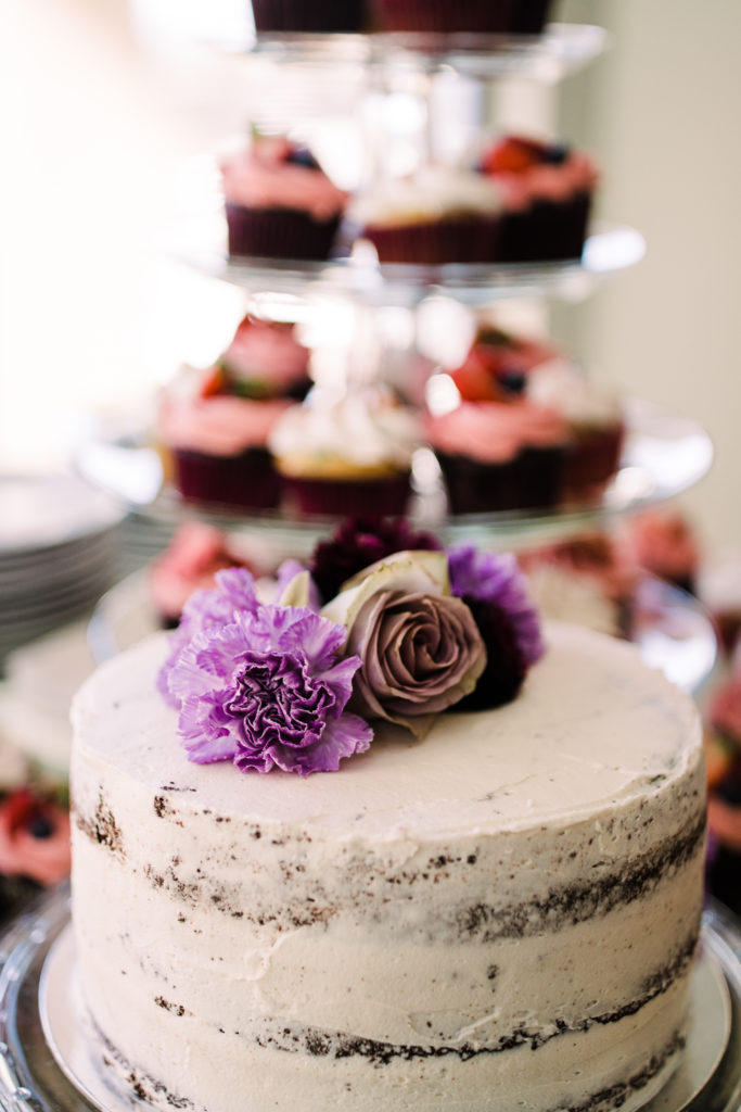 wedding cake detail with flower on top 