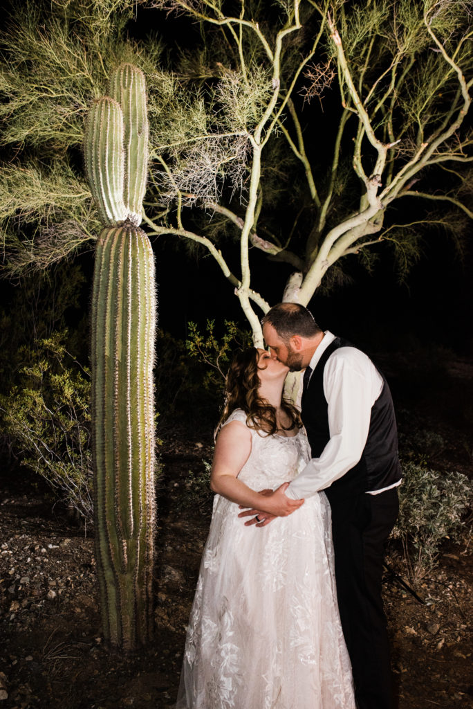 wedding night portrait in front of a saguaro cactus in the desert 
