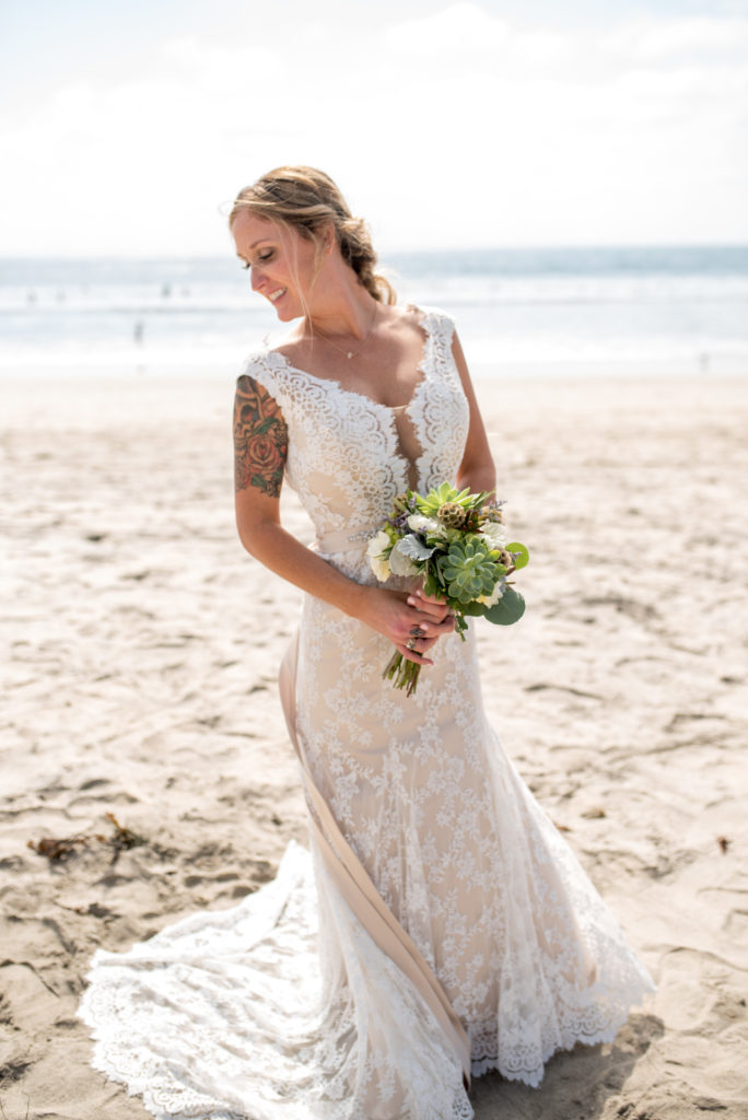 california beach wedding bride in dress with bouquet 