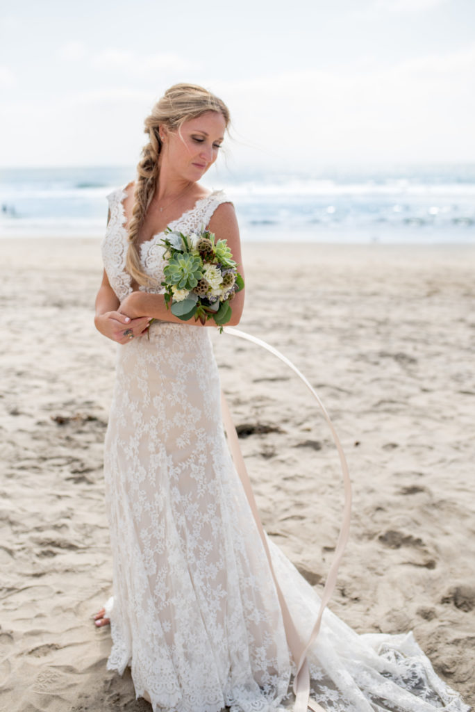 california dream beach wedding bridal photo with bouquet and ocean 