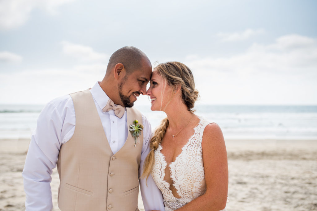 california dream beach wedding bride and groom portraits  looking at each other 