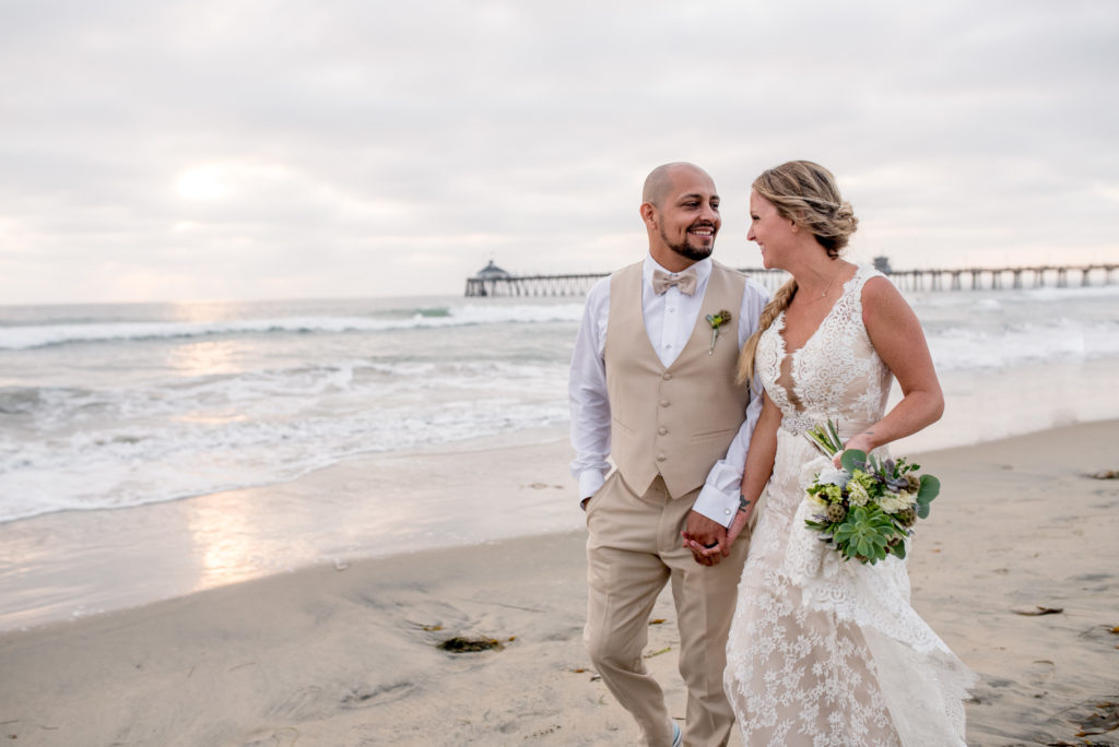 california dream beach wedding bride and groom portraits walking 