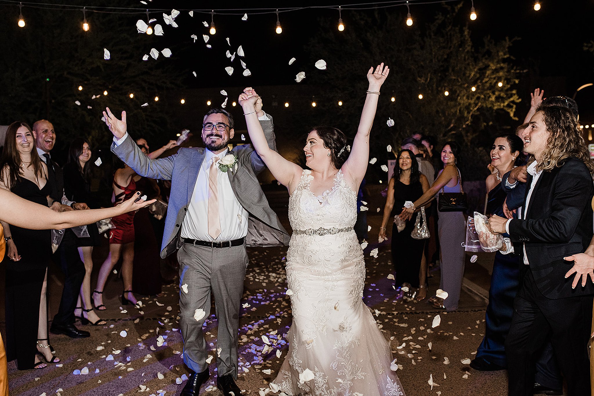 bride and groom bubble exit at a desert botanical gardens wedding